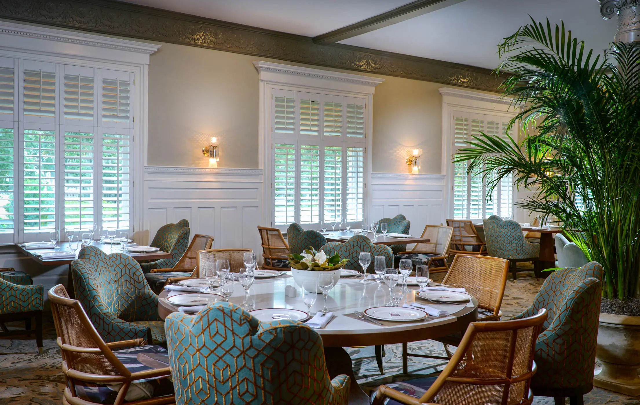 The dining room at JICR with beautiful table setup and gorgeous foliage