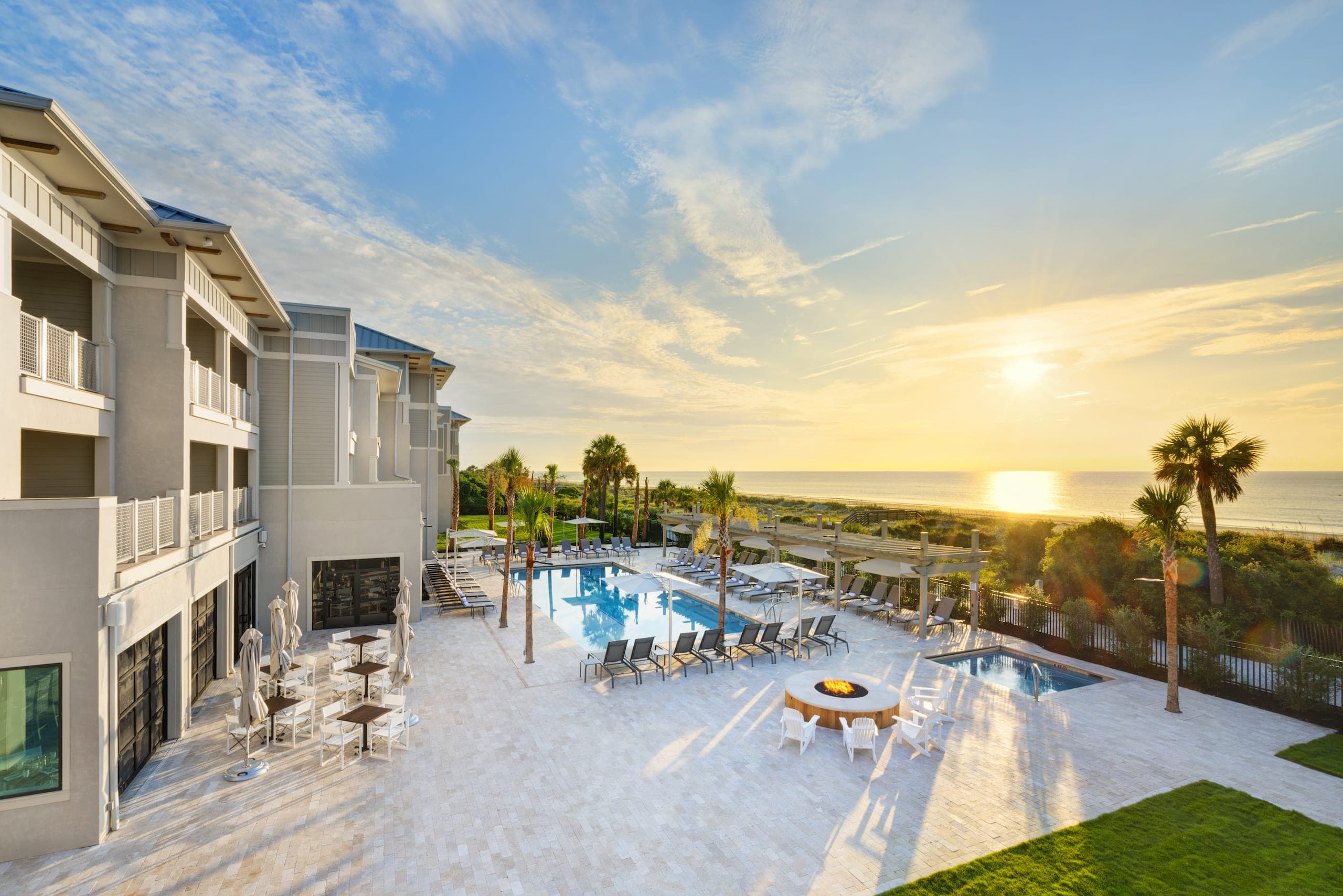 An overhead shot of some of the amenities at Jekyll Ocean Club including the pool, fire pit and beach