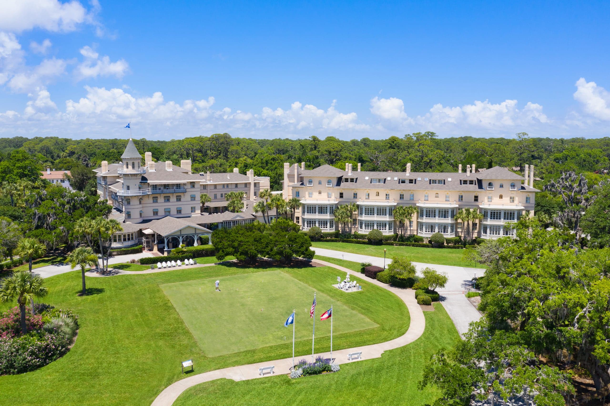 The exterior of Jekyll with manicured foliage and a bright blue sky