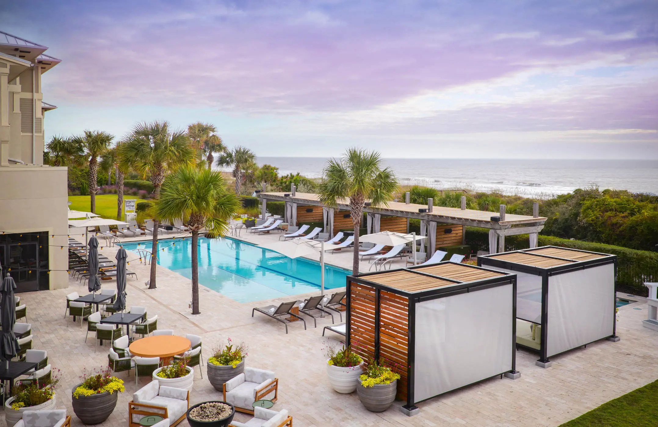 The pool at Jekyll with cabanas, lounge chairs and access to the beach